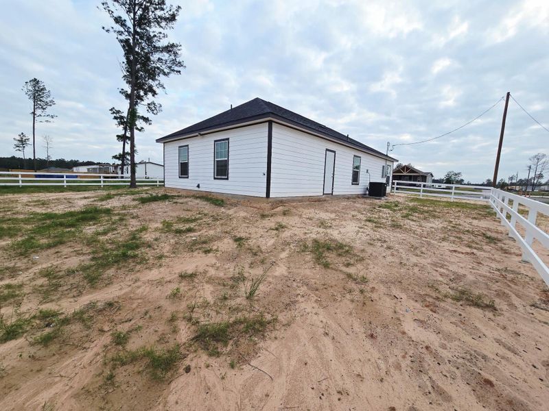 Exterior details and patio area of a home in , Conroe (Image 14).