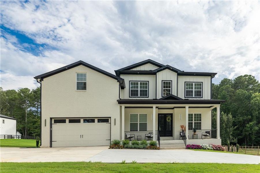 Front exterior of a new home in , Snellville, GA, highlighting curb appeal (Image 1). Front exterior of a new home in , Snellville, GA, highlighting curb appeal (Image 1).