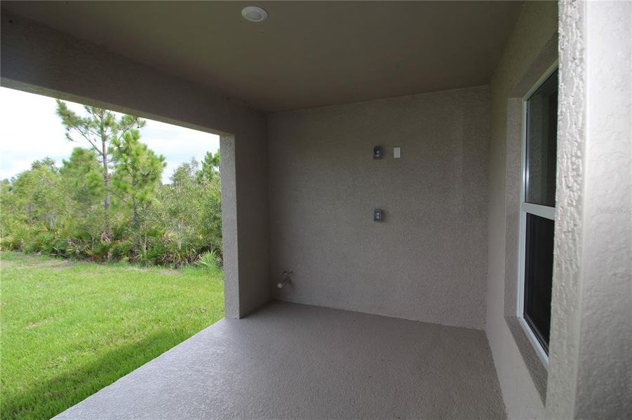 Exterior details and patio area of a home in , Port Charlotte (Image 24).