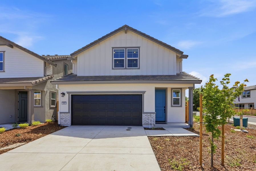 Front exterior of a new home in , Palm Coast, FL, highlighting curb appeal (Image 1). Front exterior of a new home in , Palm Coast, FL, highlighting curb appeal (Image 1).