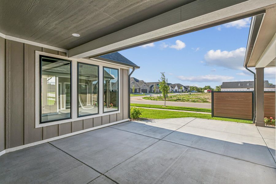 Exterior details and patio area of a home in The Courtyards at Jacobs Farm, Wichita (Image 3).