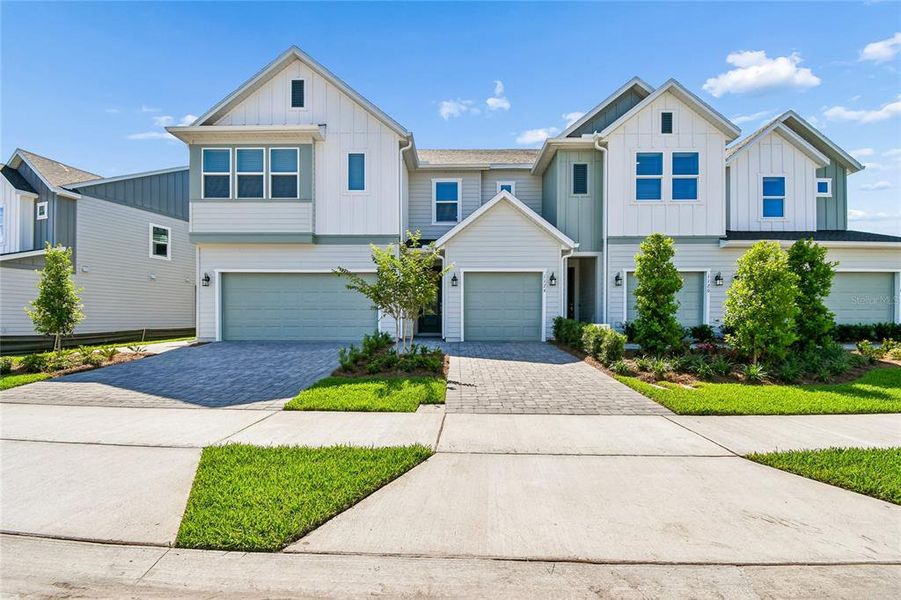 Front exterior of a new home in Preserve at The Cays – The Driftwood Series, Daytona Beach, FL, highlighting curb appeal (Image 2). Front exterior of a new home in Preserve at The Cays – The Driftwood Series, Daytona Beach, FL, highlighting curb appeal (Image 2).