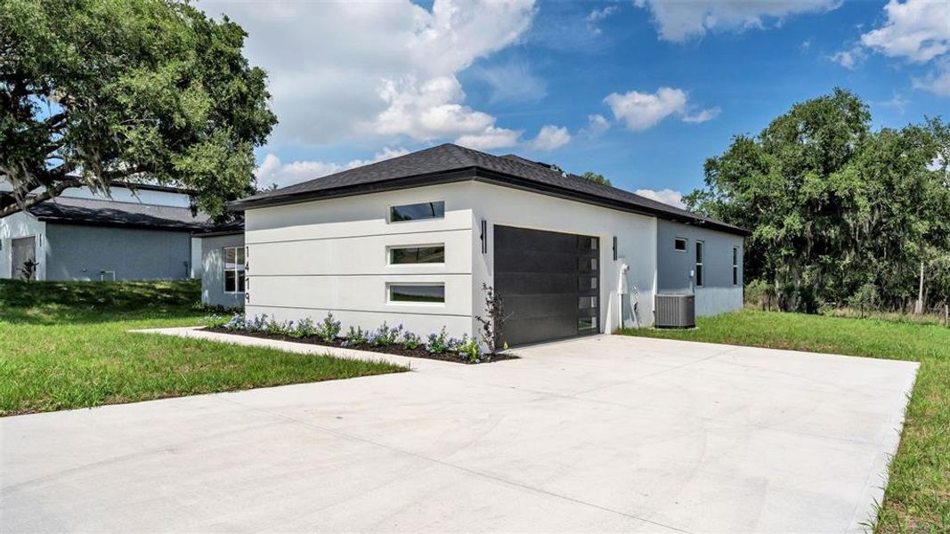 Front exterior of a new home in , Davenport, FL, highlighting curb appeal (Image 2). Front exterior of a new home in , Davenport, FL, highlighting curb appeal (Image 2).