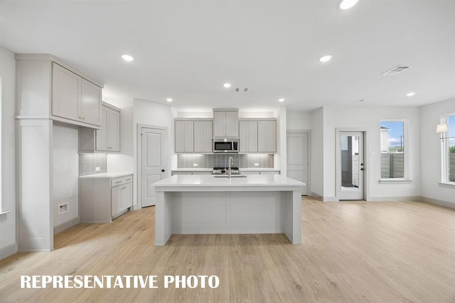 The spacious kitchen island is offers the ideal place for family and friends to gather round.  REPRESENTATIVE PHOTO