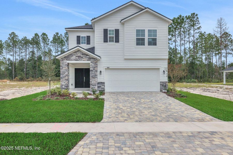 Front exterior of a new home in Brook Forest - Single Family Homes, St. Augustine, FL, highlighting curb appeal (Image 20). Front exterior of a new home in Brook Forest - Single Family Homes, St. Augustine, FL, highlighting curb appeal (Image 20).