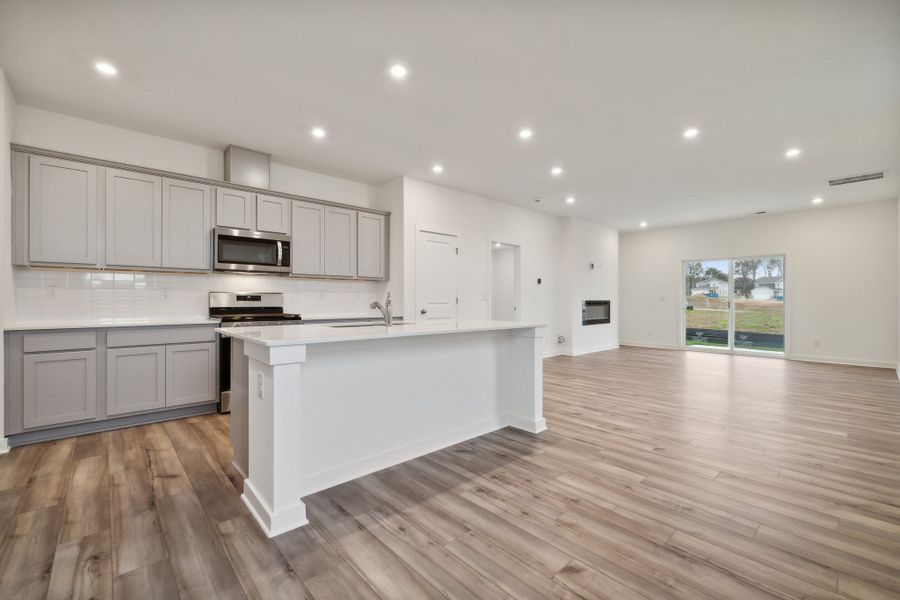 A kitchen with white cabinets. A kitchen with white cabinets.