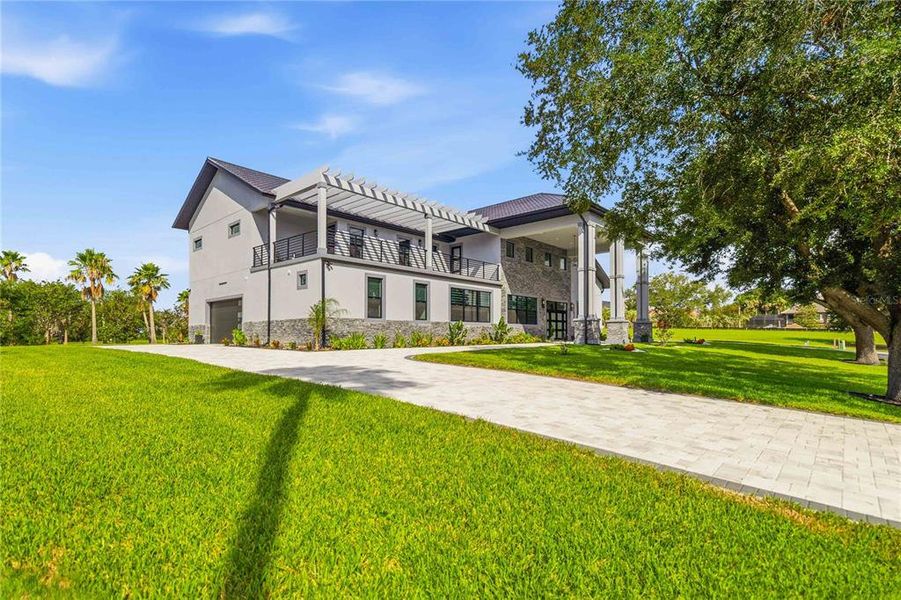 Front exterior of a new home in , Groveland, FL, highlighting curb appeal (Image 23).
