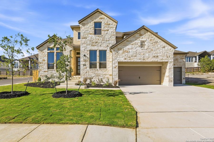 Front exterior of a new home in Kinder Ranch 70's, San Antonio, TX, highlighting curb appeal (Image 1).