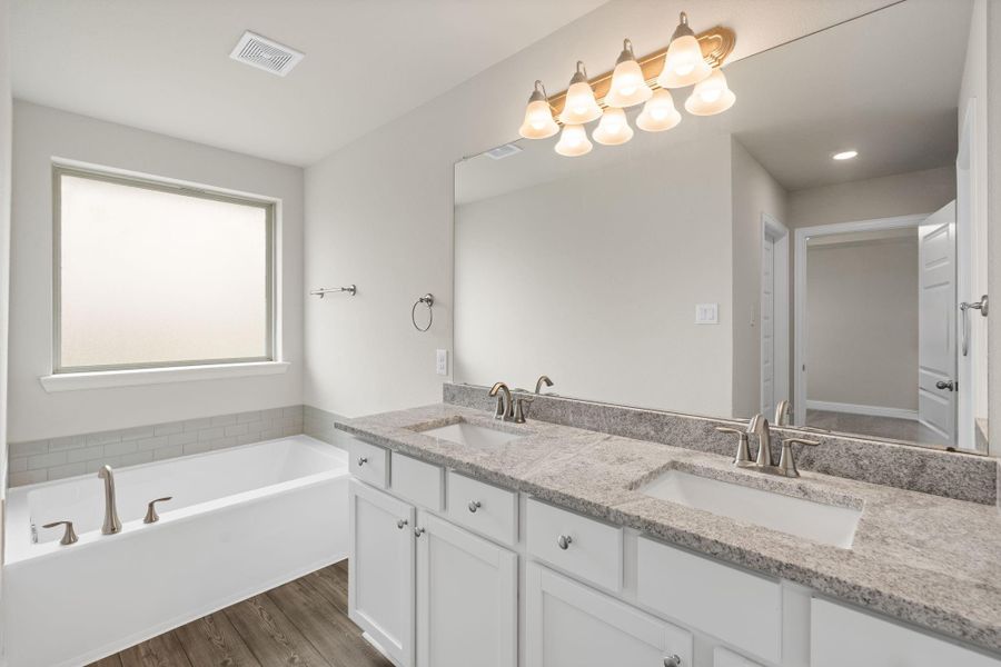 Furnished interior view inside a new home in Sunterra, Katy (Image 12).