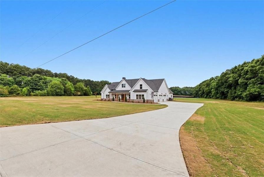 Front exterior of a new home in , Monroe, GA, highlighting curb appeal (Image 30).