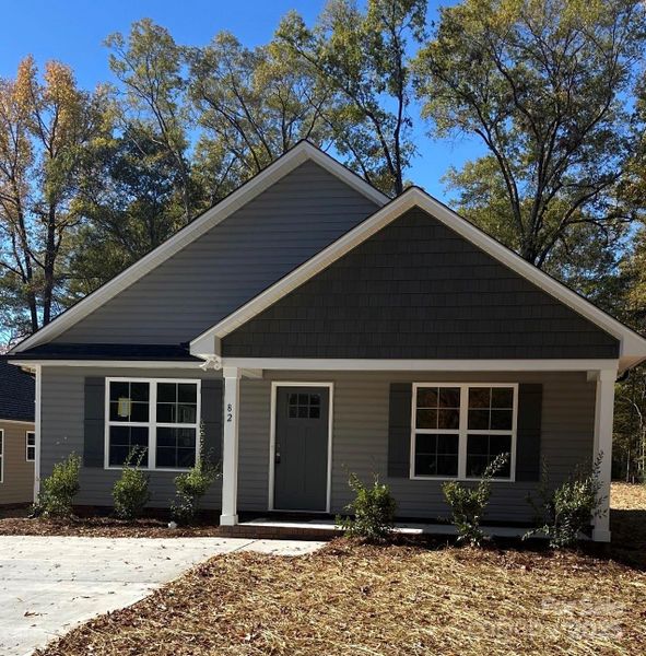 Front exterior of a new home in , Concord, NC, highlighting curb appeal (Image 1).