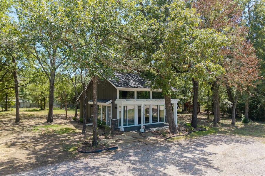 Front exterior of a new home in , Log Cabin, TX, highlighting curb appeal (Image 26).