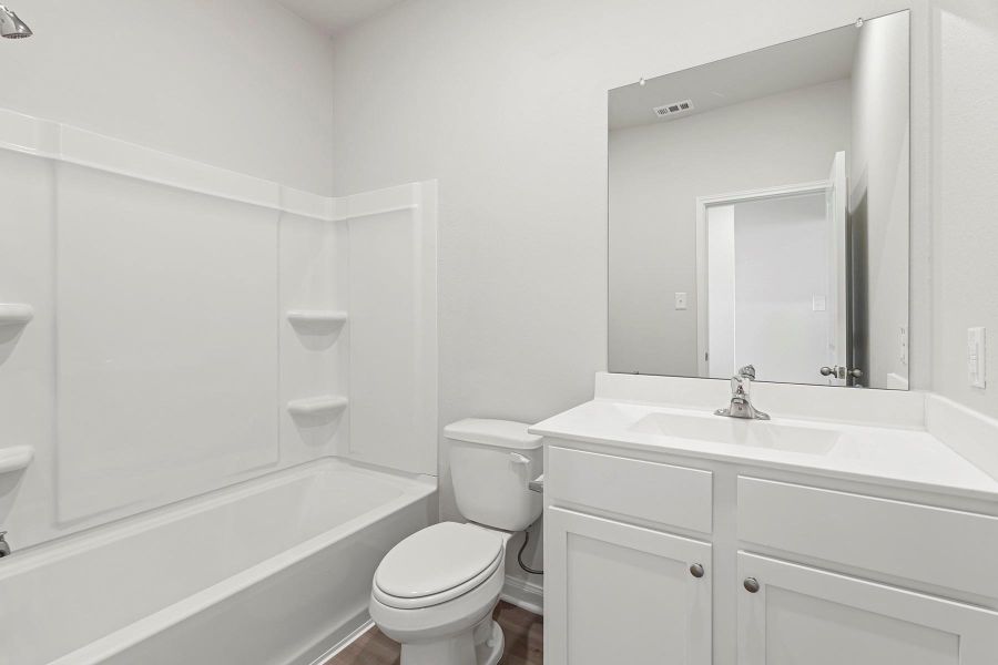 Furnished interior view inside a new home in Canterra Creek, Iowa Colony (Image 3).
