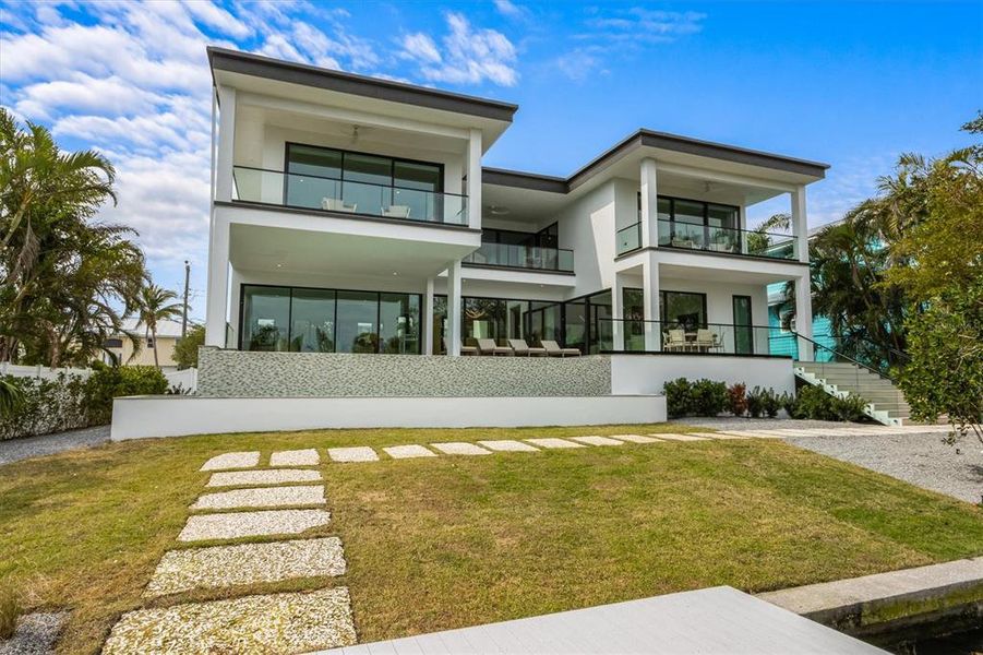 Front exterior of a new home in , Holmes Beach, FL, highlighting curb appeal (Image 24).