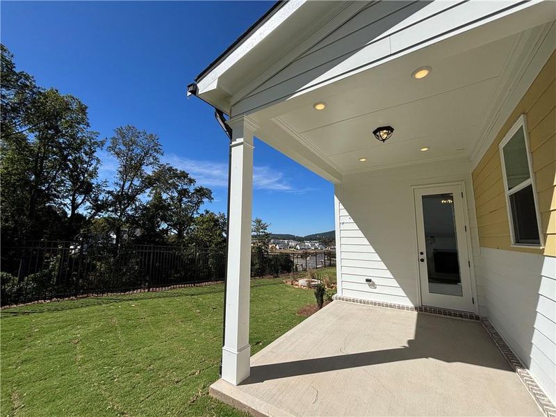 Exterior details and patio area of a home in Palisades Single Family, Cumming (Image 2).