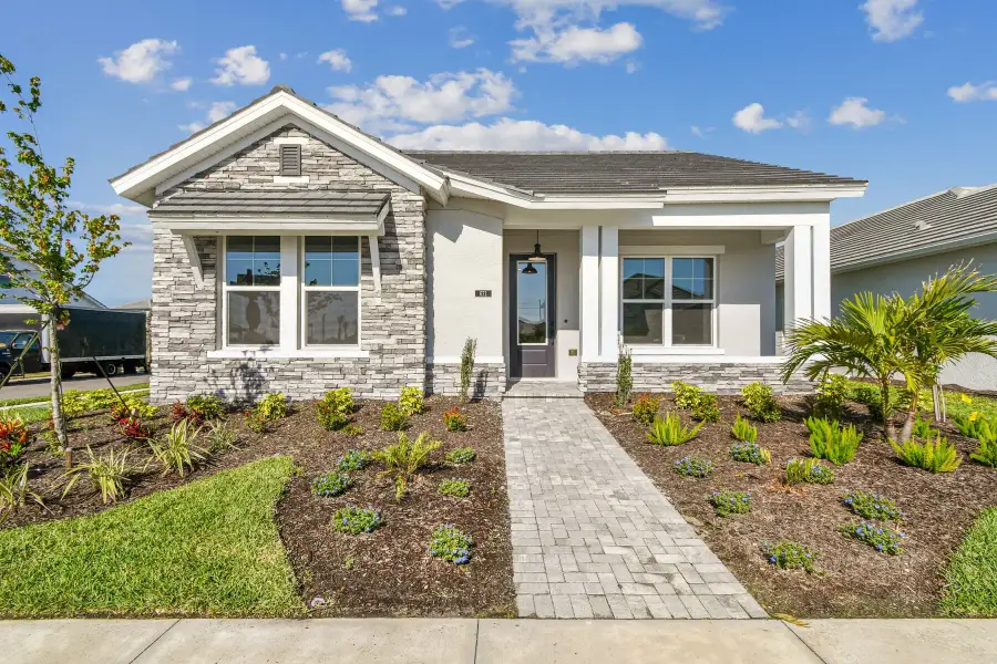 Representative exterior photo of a completed home built from the The Mapleton by David Weekley Homes in Vistera of Venice – Cottage Series, Nokomis, FL (Image 1). Representative exterior photo of a completed home built from the The Mapleton by David Weekley Homes in Vistera of Venice – Cottage Series, Nokomis, FL (Image 1).