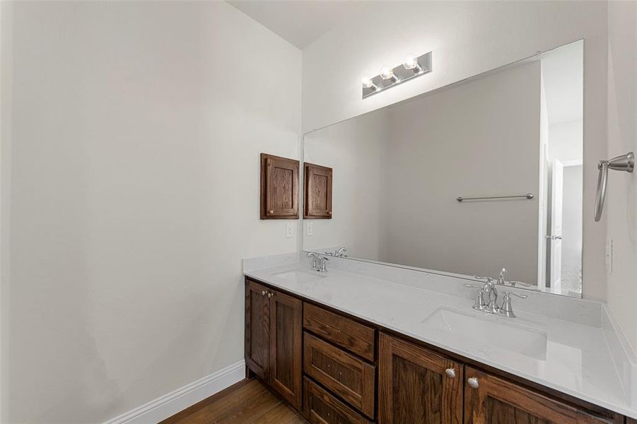 Bathroom featuring hardwood / wood-style floors and vanity