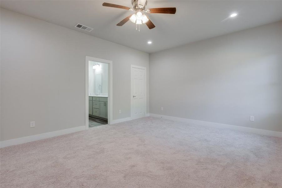 Similar home: Primary bedroom with carpet flooring and ceiling fan