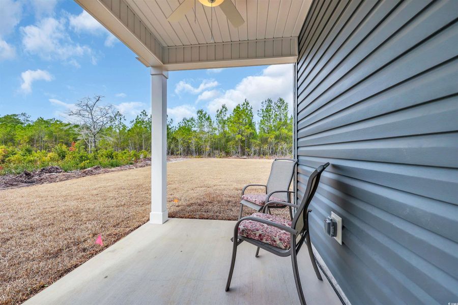 View of patio featuring ceiling fan