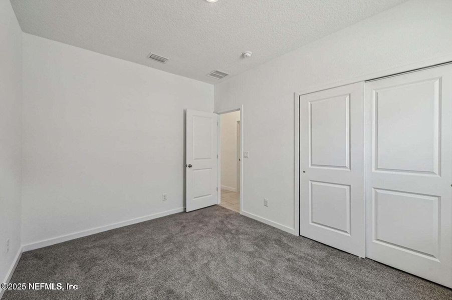 Spacious, unfurnished interior of a new home in Lakes at Bella Lago - Signature Series, Green Cove Springs (Image 26).