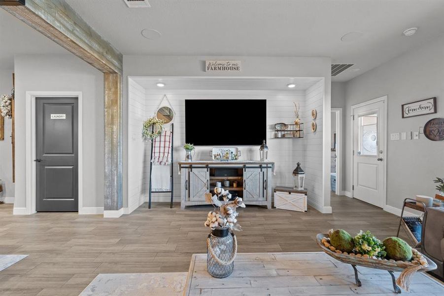 Living room with light wood-type flooring