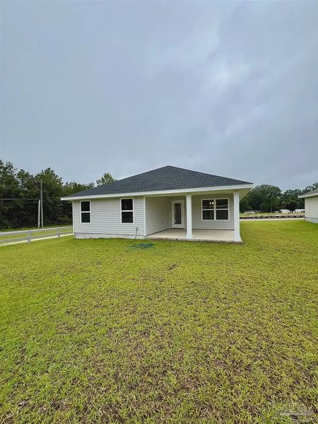 Front exterior of a new home in Pine Top, Cantonment, FL, highlighting curb appeal (Image 2).