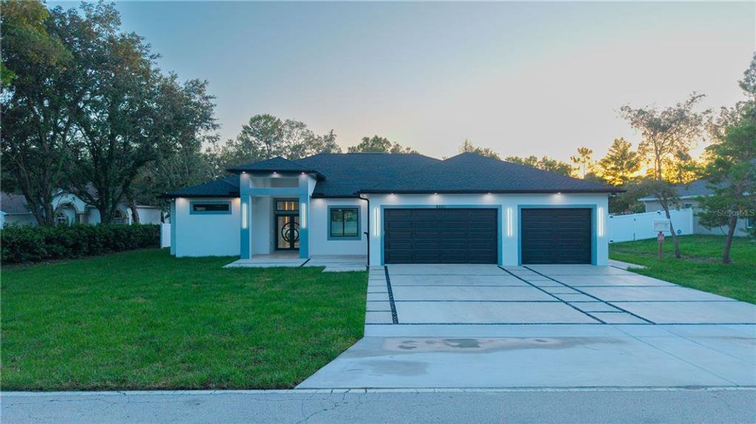 Front exterior of a new home in , Weeki Wachee, FL, highlighting curb appeal (Image 33).