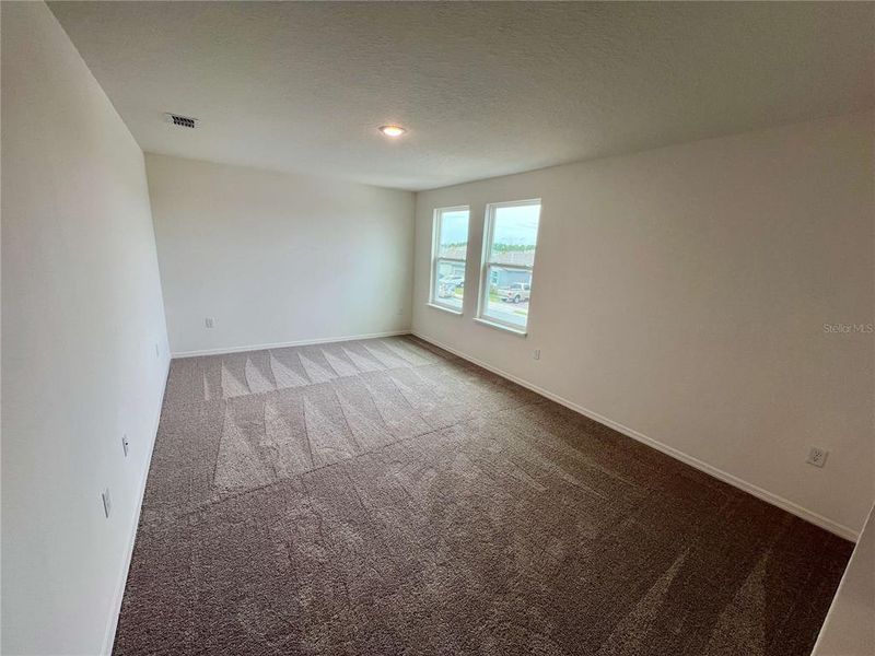 Spacious, unfurnished interior of a new home in Villamar, Winter Haven (Image 17).