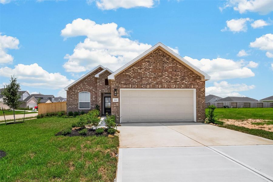 Front exterior of a new home in , Angleton, TX, highlighting curb appeal (Image 25).