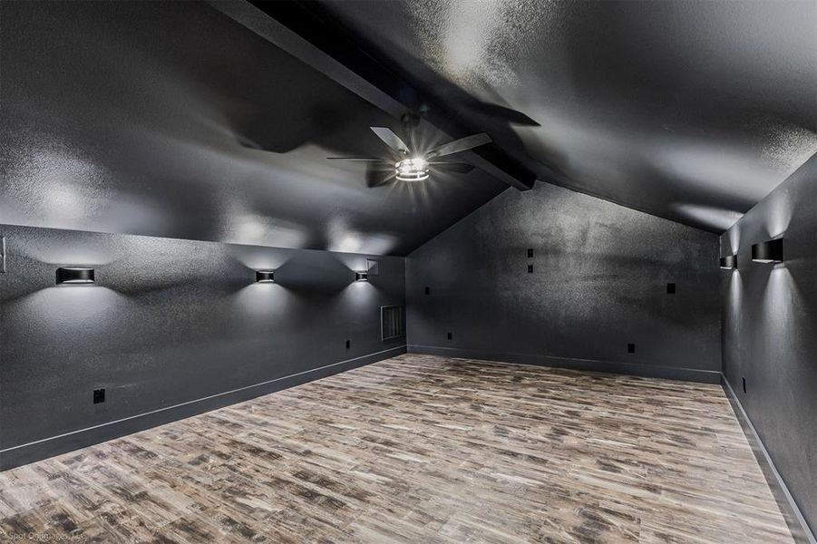 Media Room is wired for surround sound and wired to the media closet downstairs. Mini Fridge, Cabinetry, Microwave and Custom Lighting.