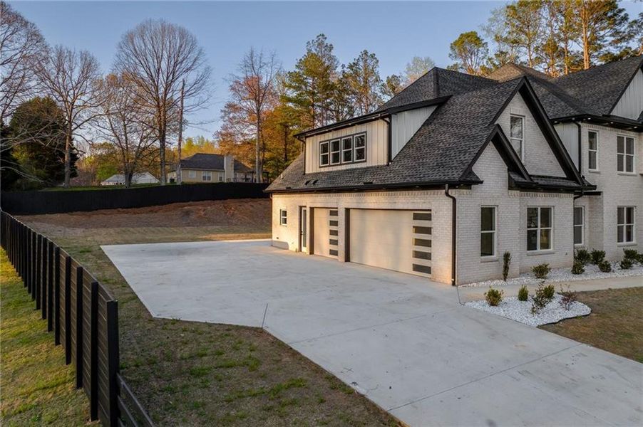 Front exterior of a new home in , Loganville, GA, highlighting curb appeal (Image 31).