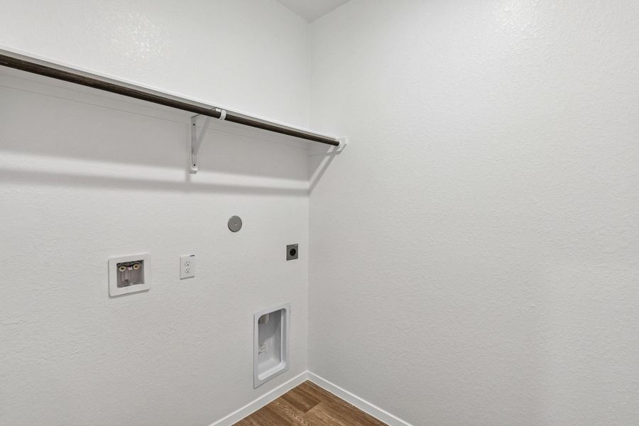 The utility room makes managing everyday tasks easy while keeping everything neat and accessible.
