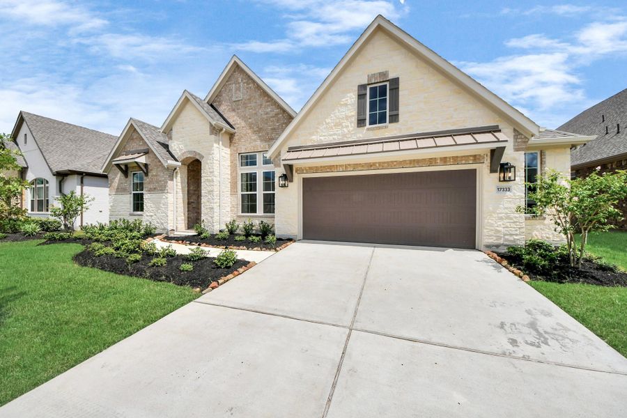 Front exterior of a new home in ARTAVIA: Hilltop Collection, Conroe, TX, highlighting curb appeal (Image 24). Front exterior of a new home in ARTAVIA: Hilltop Collection, Conroe, TX, highlighting curb appeal (Image 24).