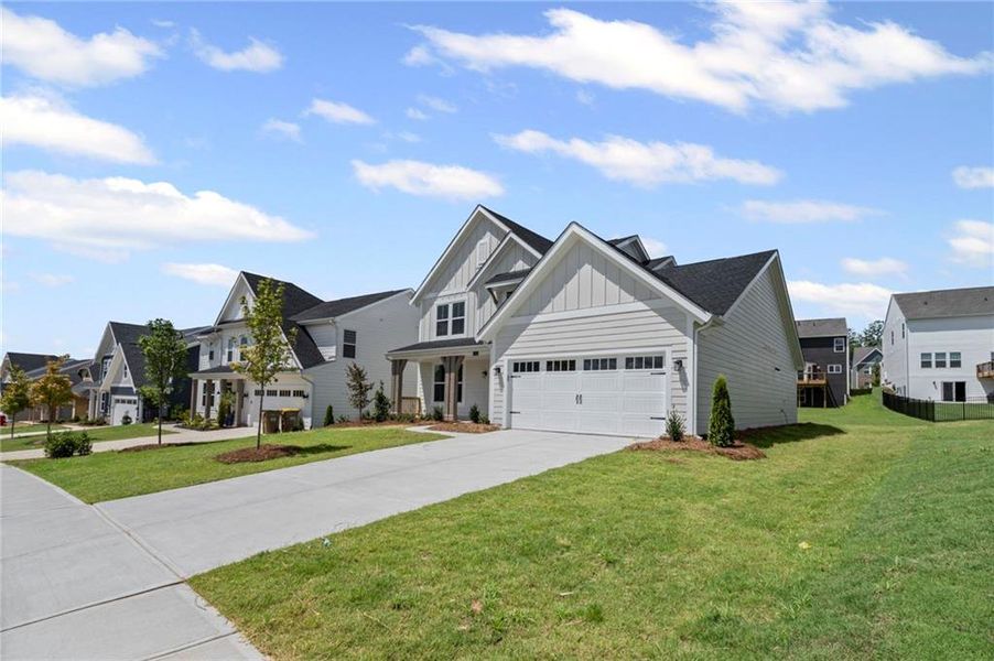 Front exterior of a new home in Twin Lakes, Hoschton, GA, highlighting curb appeal (Image 25).