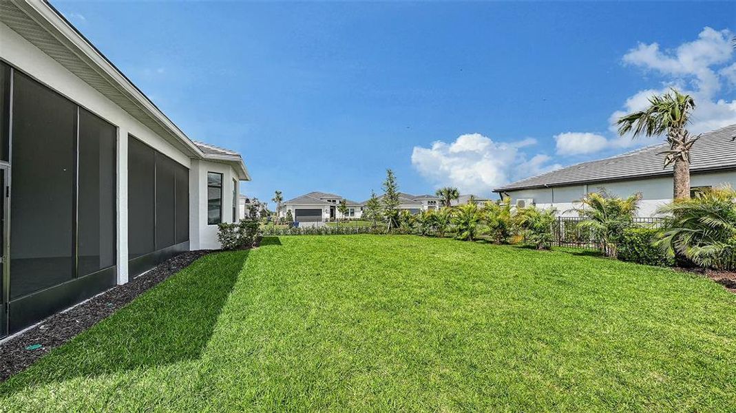 Exterior details and patio area of a home in Artistry Sarasota, Sarasota (Image 32).