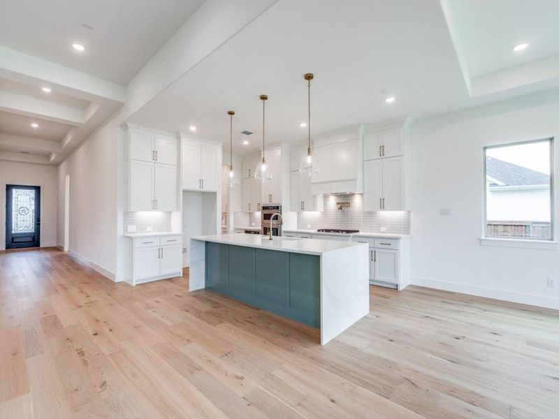 The spacious kitchen island is the hub of your new dream kitchen!