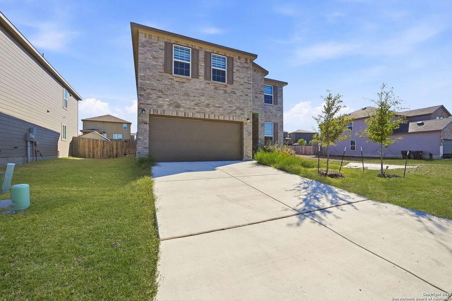 Front exterior of a new home in Cinco Lakes, San Antonio, TX, highlighting curb appeal (Image 17). Front exterior of a new home in Cinco Lakes, San Antonio, TX, highlighting curb appeal (Image 17).