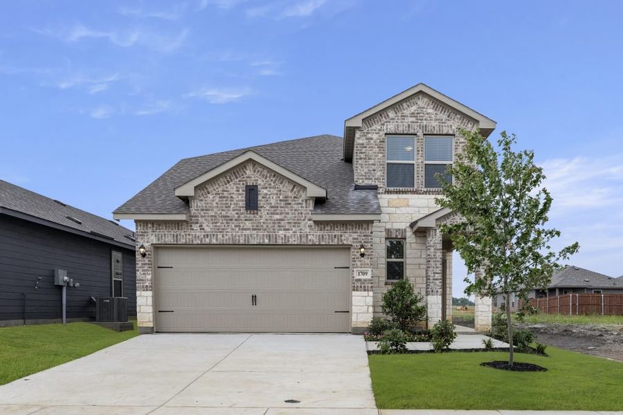 Representative exterior photo of a completed home built from the Willow by Impression Homes in Creekside Ranch, Blue Ridge, TX (Image 1).