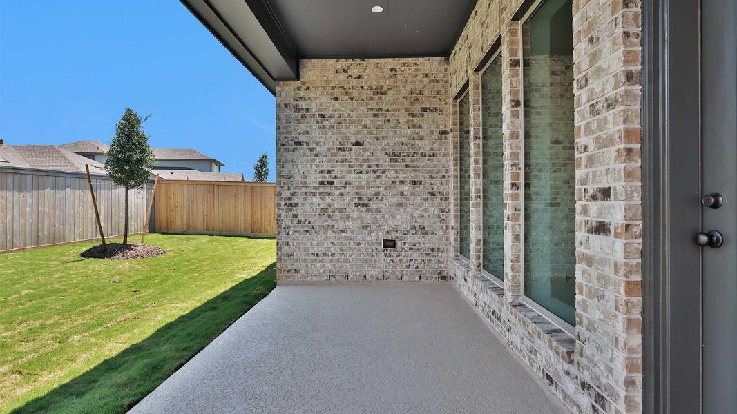 Exterior details and patio area of a home in Bridgeland, Cypress (Image 3).