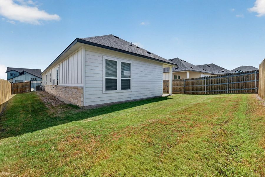 Exterior details and patio area of a home in Cascades at Onion Creek, Austin (Image 24).