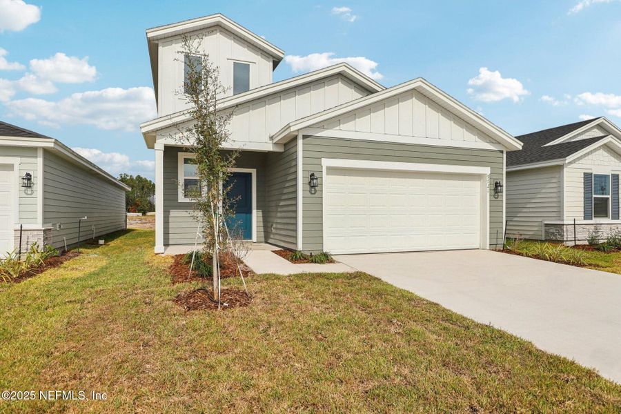 Front exterior of a new home in Cypress Meadows - Classic Series, Jacksonville, FL, highlighting curb appeal (Image 2).