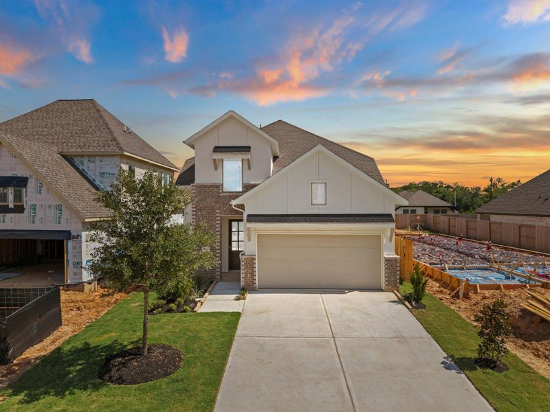 Front exterior of a new home in Candela, Richmond, TX, highlighting curb appeal (Image 22). Front exterior of a new home in Candela, Richmond, TX, highlighting curb appeal (Image 22).