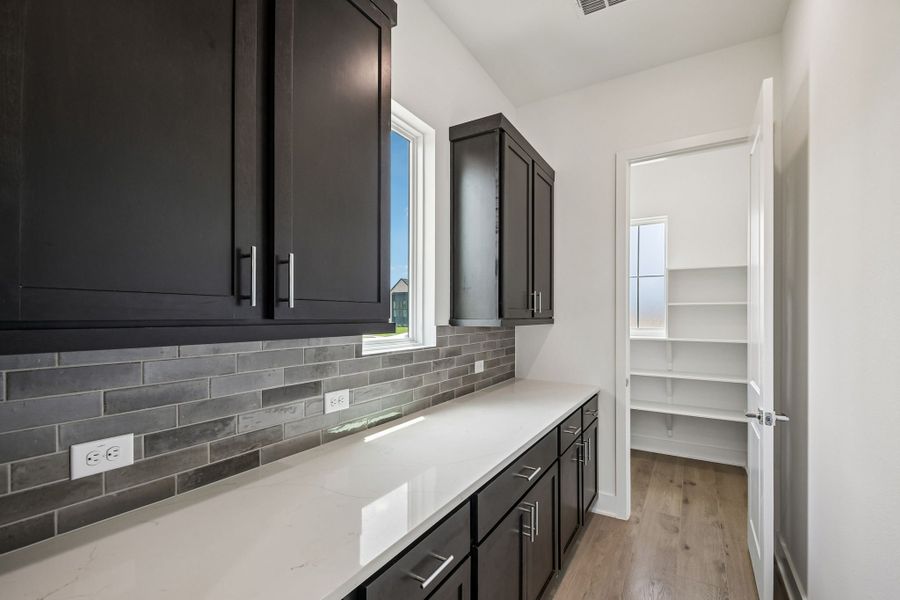 Furnished interior view inside a new home in Freedom at Anthem, Kyle (Image 6).