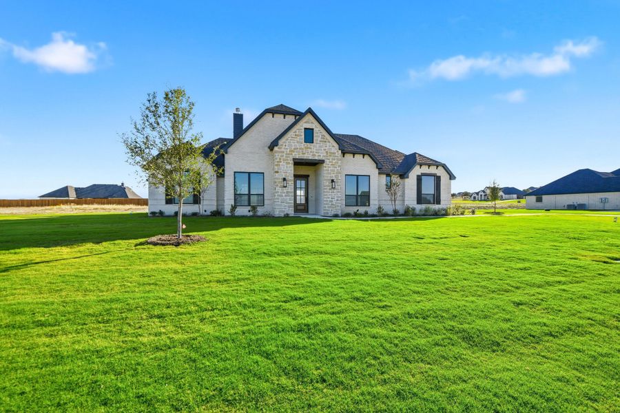 Front exterior of a new home in Aledo Heights - Aledo ISD, Aledo, TX, highlighting curb appeal (Image 29).