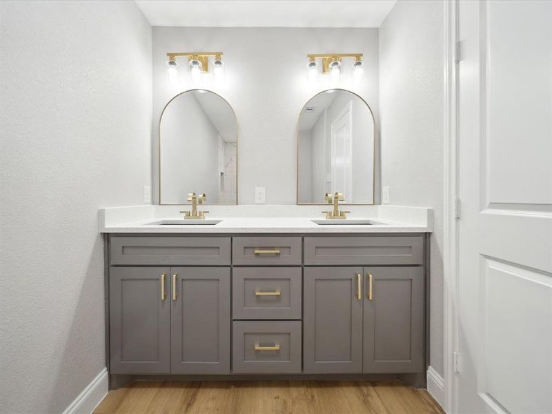 Bathroom with vanity and hardwood / wood-style flooring