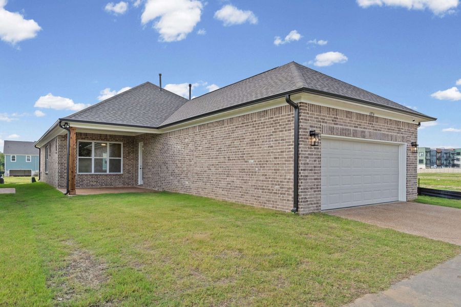 Brick exterior with a two-car garage Brick exterior with a two-car garage