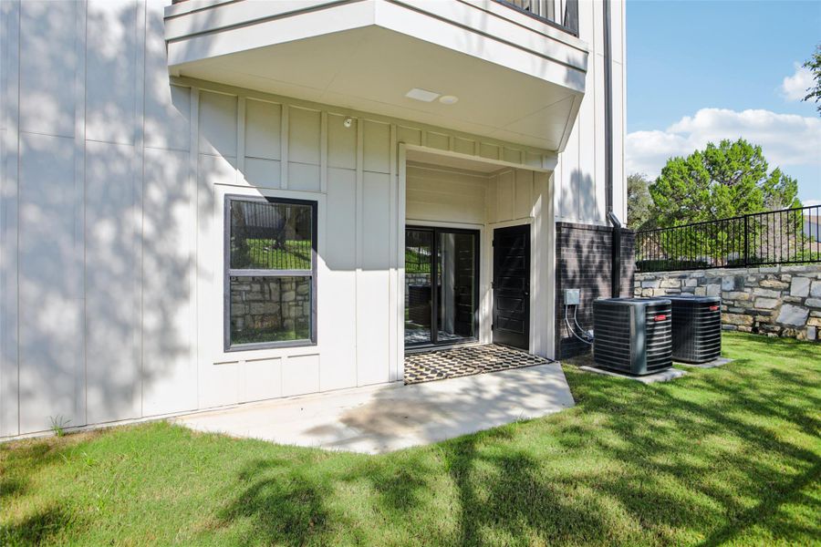 Doorway to property featuring a patio area and board and batten siding