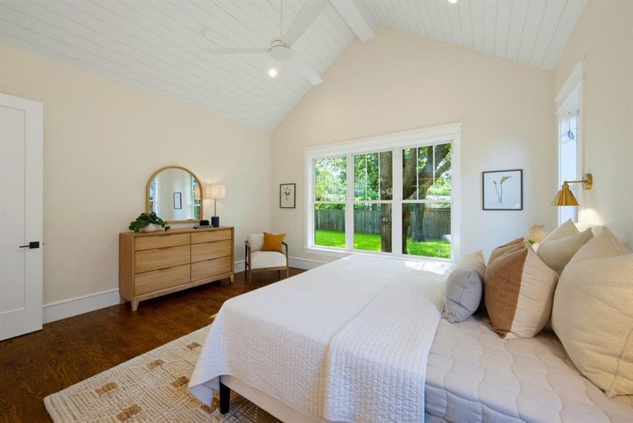 Vaulted plank ceiling, hardwood flooring, large picture window, and recessed lighting