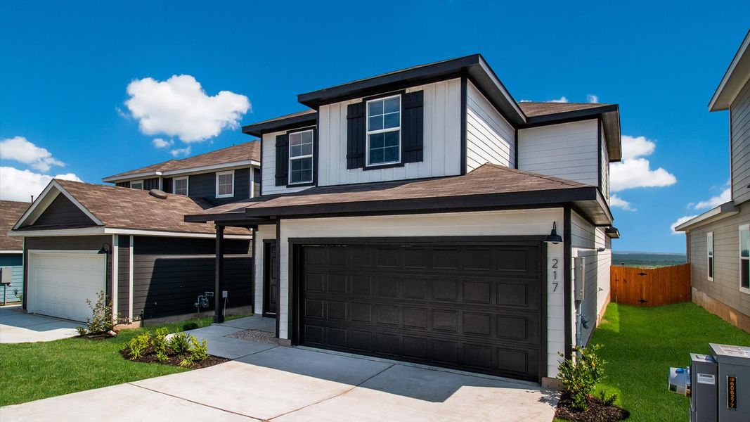 Front exterior of a new home in Wayside, Uhland, TX, highlighting curb appeal (Image 1). Front exterior of a new home in Wayside, Uhland, TX, highlighting curb appeal (Image 1).