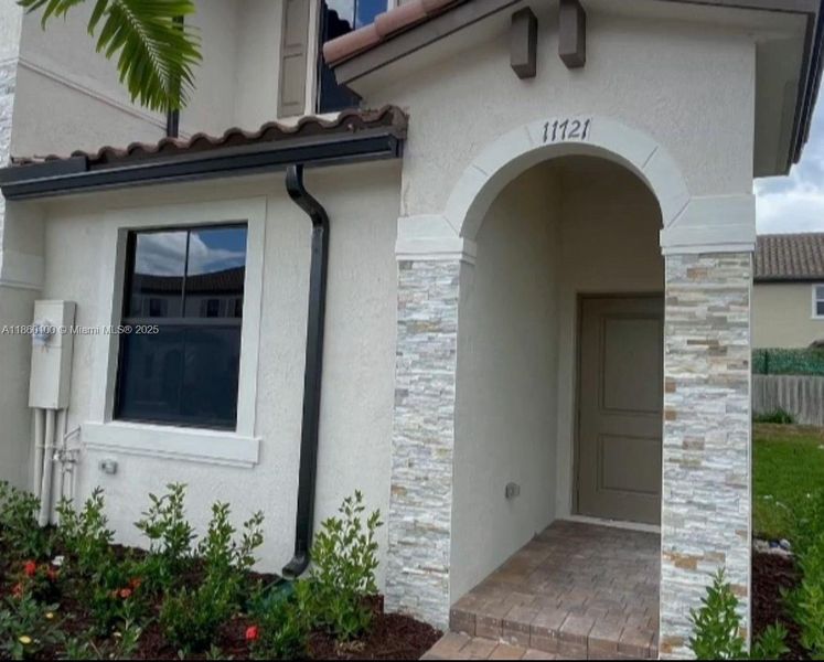 Front exterior of a new home in , Homestead, FL, highlighting curb appeal (Image 10). Front exterior of a new home in , Homestead, FL, highlighting curb appeal (Image 10).